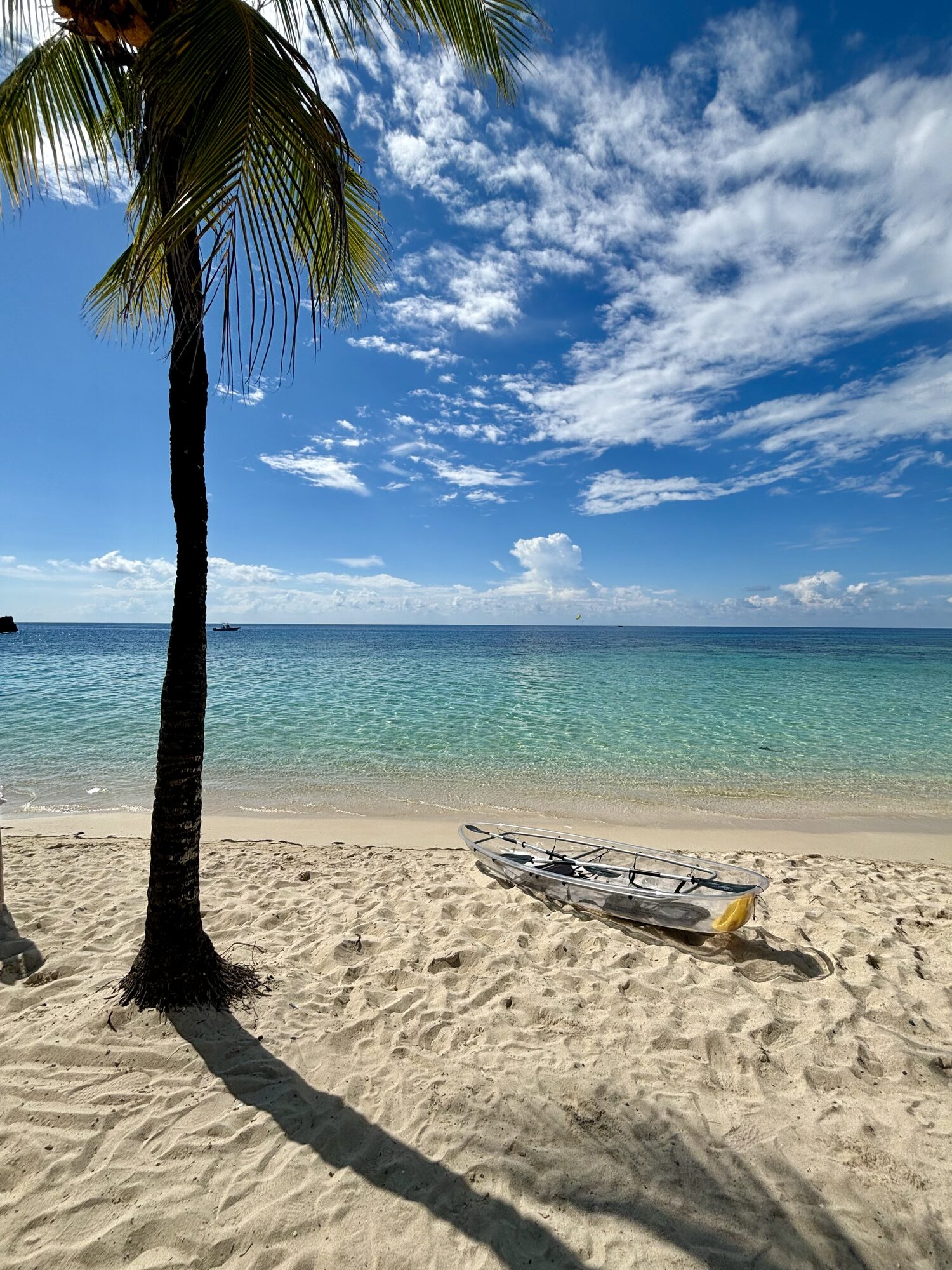 Clear kayak on the white sand beach