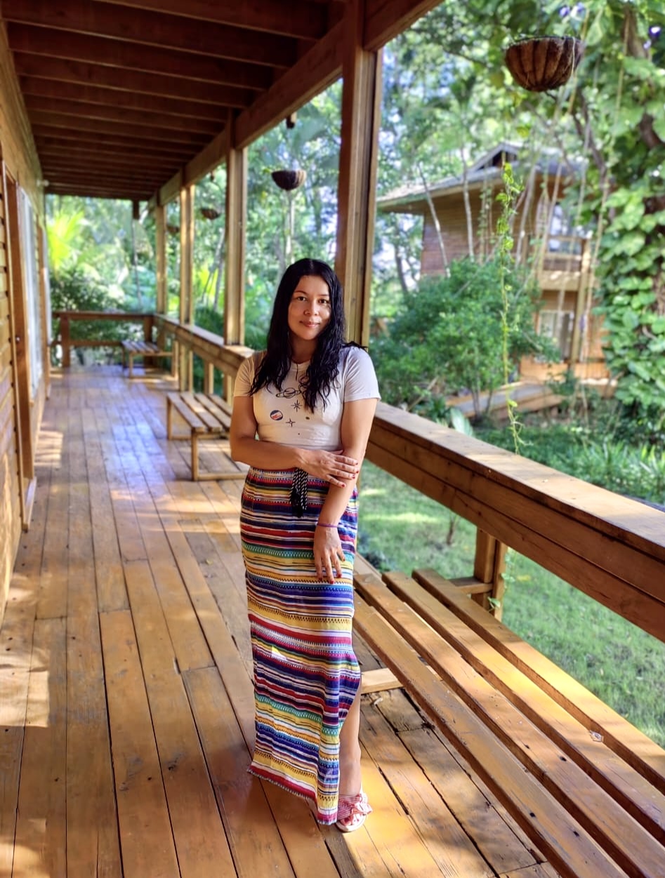 A guest enjoying the wooden veranda